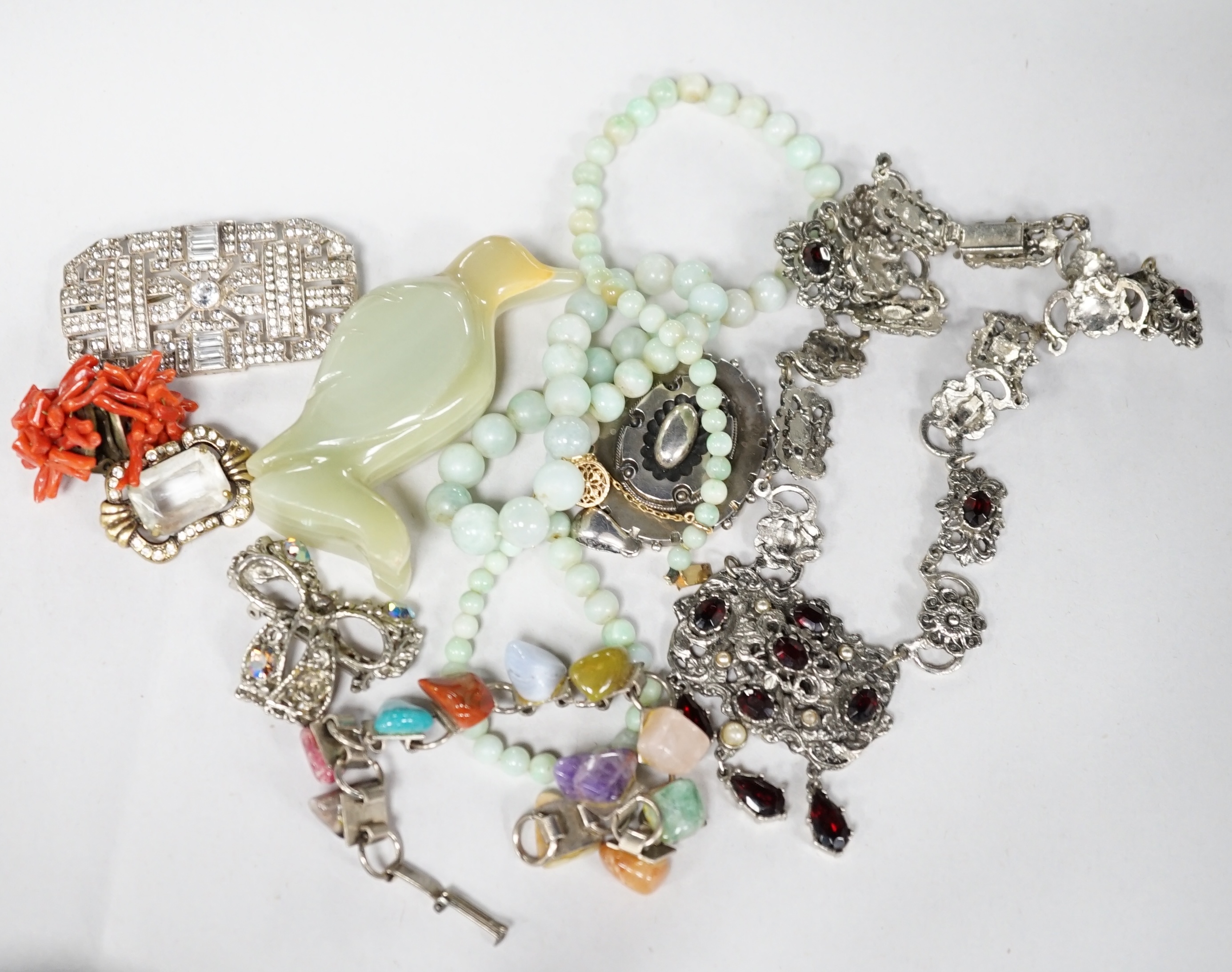 A quantity of assorted jewellery including necklaces, paste set costume, a Victorian white metal locket, hardstone bracelet etc. Condition - poor to fair